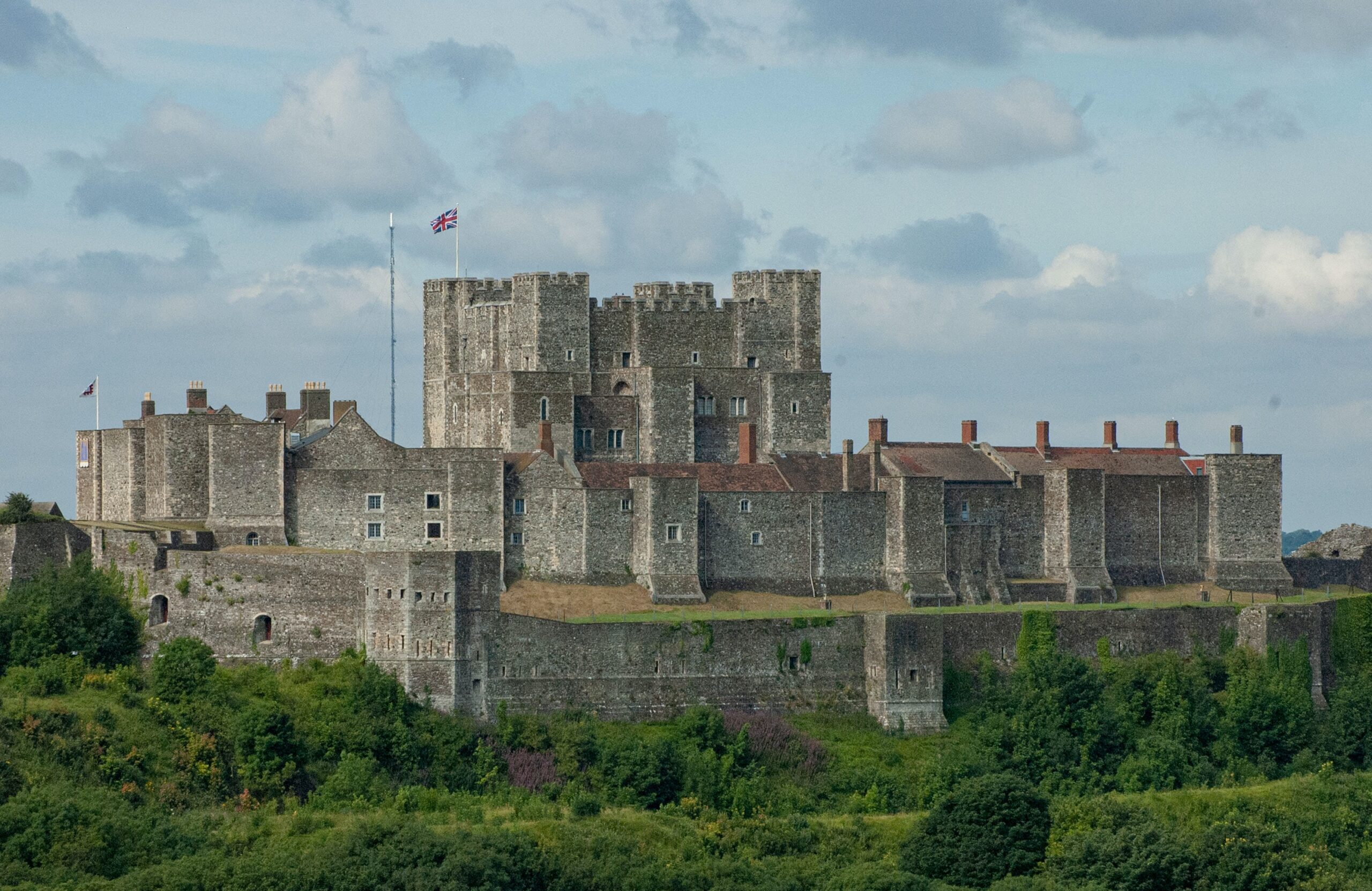 Dover Castle in Kent against a blue sky and the sea