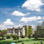 Hever Castle in Kent with blue skies and green grass