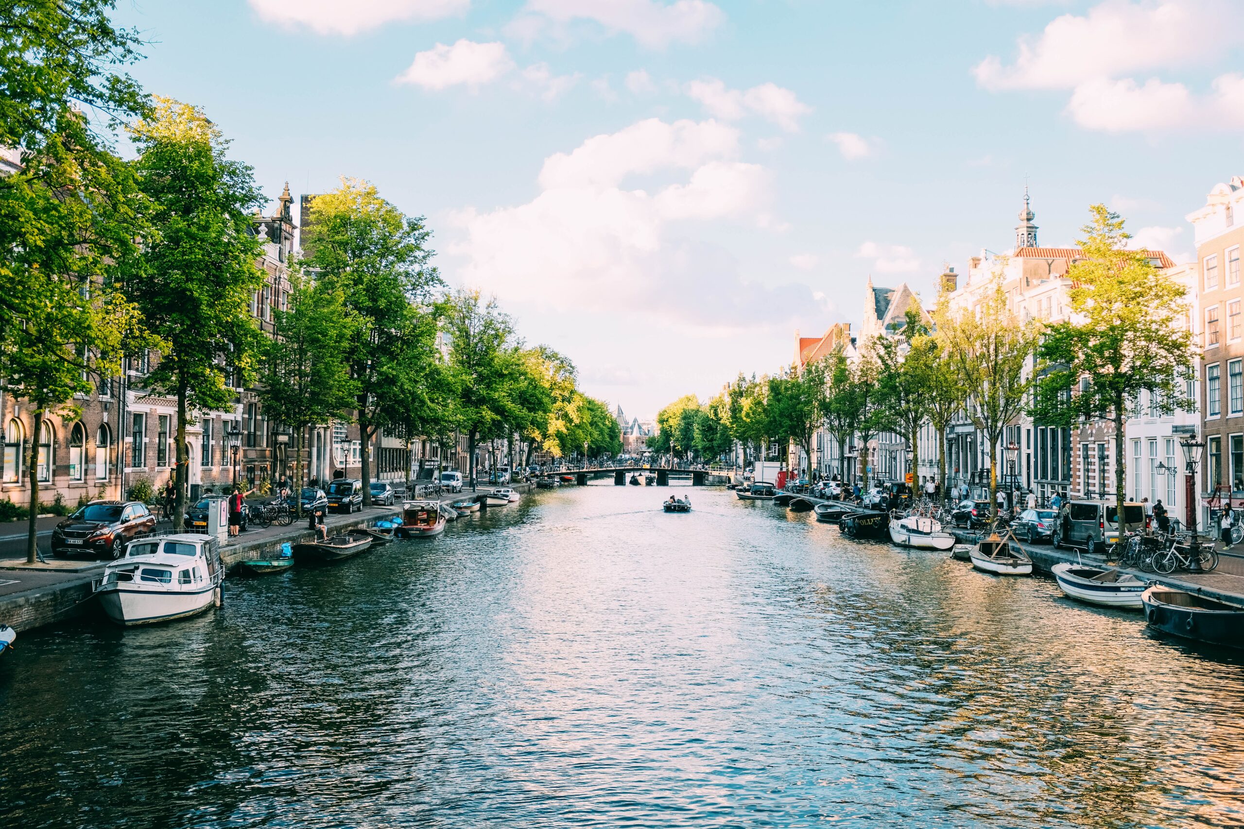 a canal in Amsterdam on a clear day