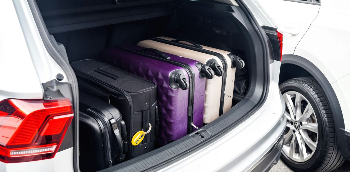 a car boot filled with suitcases