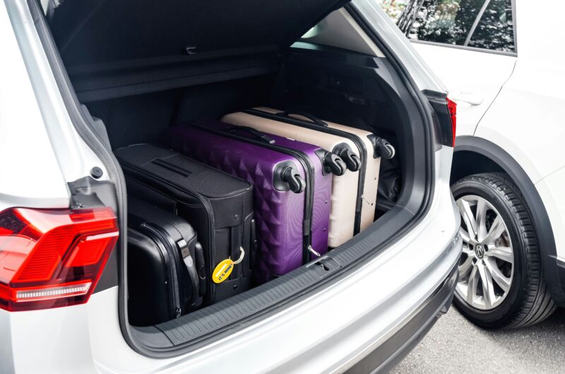 a car boot filled with suitcases