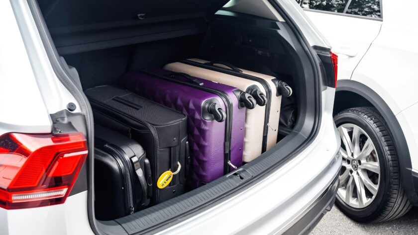 a car boot filled with suitcases