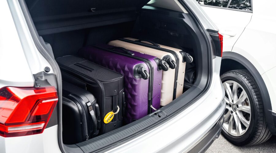 a car boot filled with suitcases