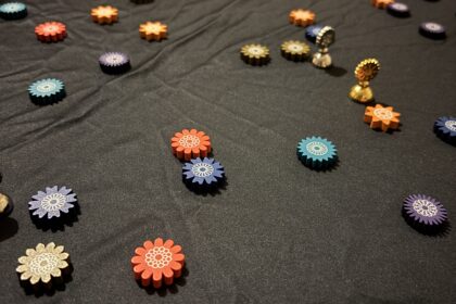 Pieces from Lacuna the game are scattered on the game play mat.