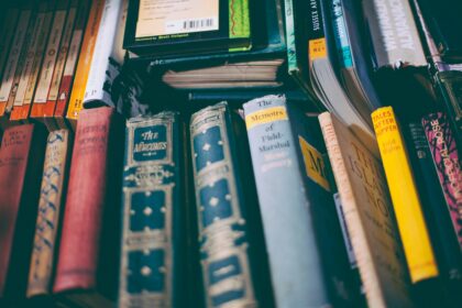 a pile of old classic books